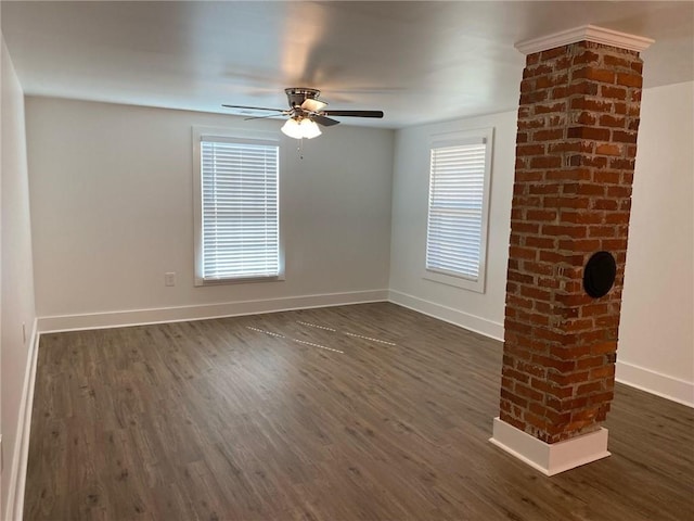 unfurnished room with ceiling fan and dark wood-type flooring