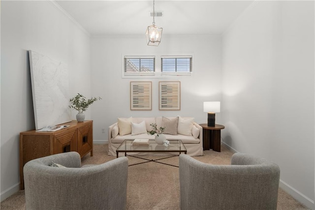 carpeted living room with baseboards, visible vents, and ornamental molding