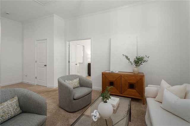 living area with carpet flooring, crown molding, and baseboards
