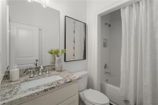 bathroom with vanity, toilet, and shower / tub combo