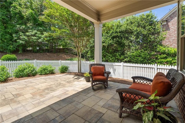 view of patio / terrace featuring fence