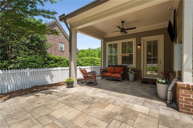 view of patio with a ceiling fan, fence, and an outdoor hangout area