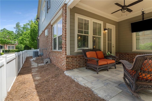 view of patio featuring an outdoor living space, a fenced backyard, ceiling fan, and central AC