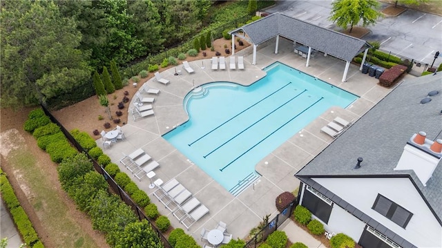 community pool with a patio area