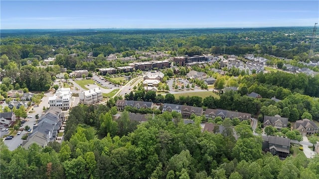 birds eye view of property with a residential view and a forest view