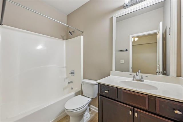 bathroom with vanity, toilet, and bathtub / shower combination