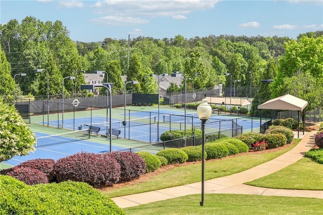view of sport court featuring fence