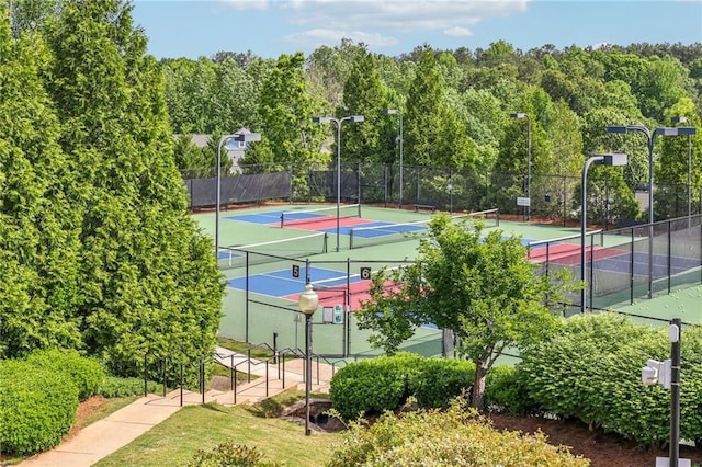 view of sport court with fence