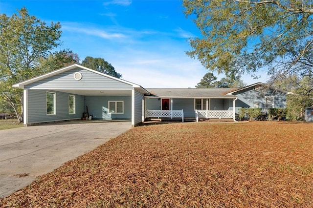 ranch-style house featuring a carport