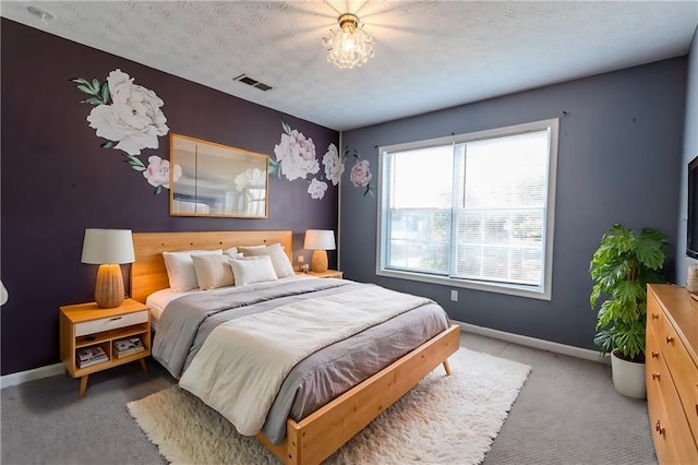 335 Wilma Ct SW, Atlanta, GA 30331 - carpeted bedroom with baseboards and a textured ceiling