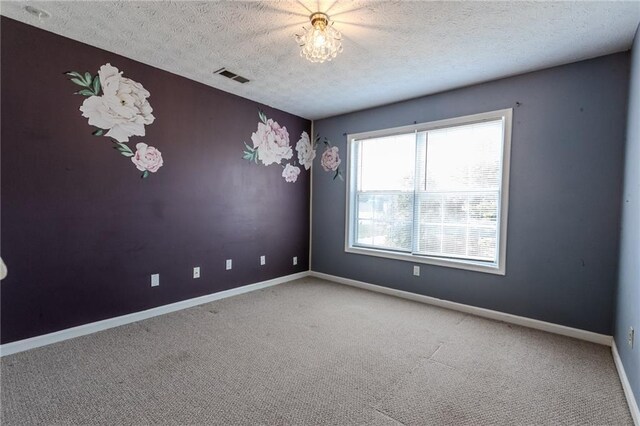 335 Wilma Ct SW, Atlanta, GA 30331 - carpeted spare room with a textured ceiling and baseboards