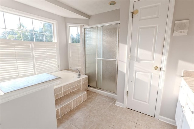 335 Wilma Ct SW, Atlanta, GA 30331 - bathroom featuring tile patterned floors, a garden tub, a stall shower, and vanity