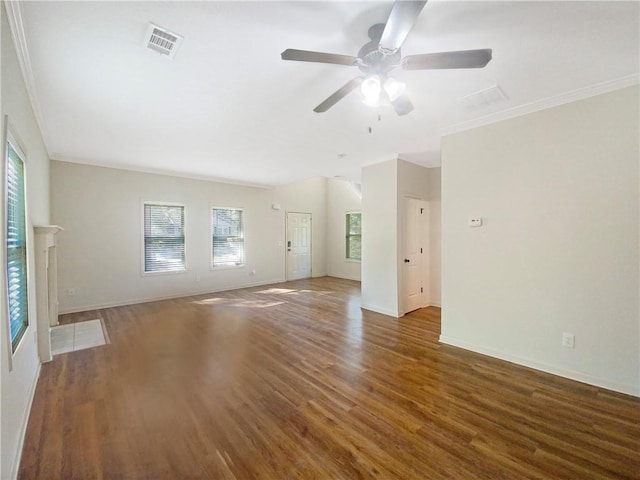 spare room featuring crown molding, dark hardwood / wood-style floors, and ceiling fan