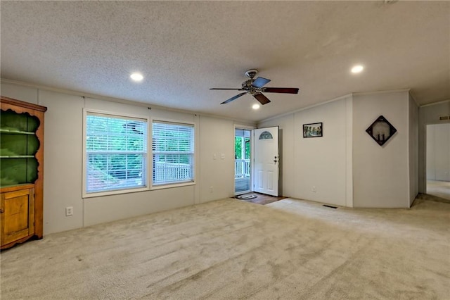 empty room with ceiling fan, carpet, ornamental molding, lofted ceiling, and recessed lighting