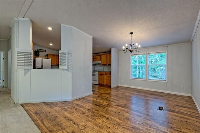 unfurnished living room featuring a chandelier, wood finished floors, baseboards, a textured ceiling, and recessed lighting