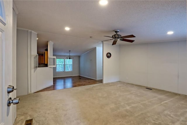unfurnished living room featuring carpet, recessed lighting, a ceiling fan, a textured ceiling, and lofted ceiling