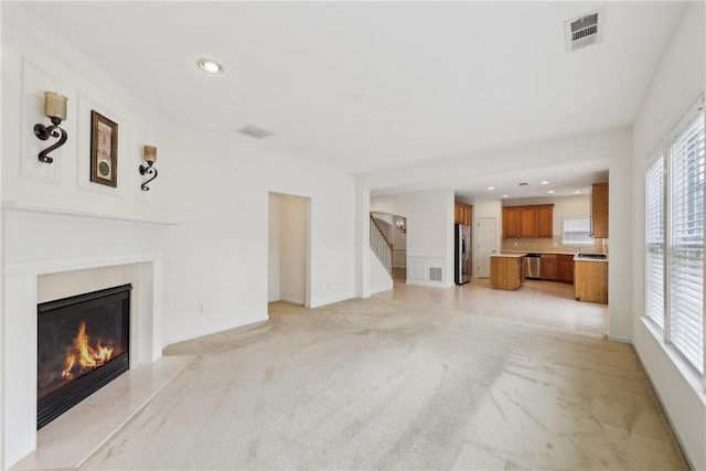 230 Collins View Ct, Lawrenceville, GA 30043 - unfurnished living room featuring a fireplace, stairway, recessed lighting, baseboards, and light carpet