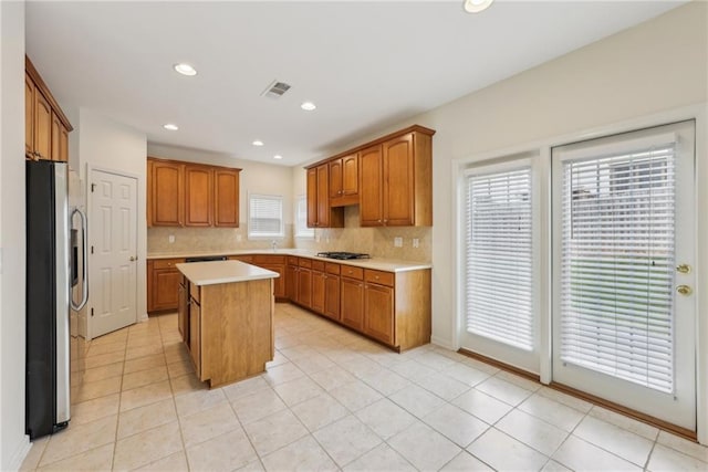 230 Collins View Ct, Lawrenceville, GA 30043 - kitchen with freestanding refrigerator, gas stovetop, backsplash, a kitchen island, and recessed lighting