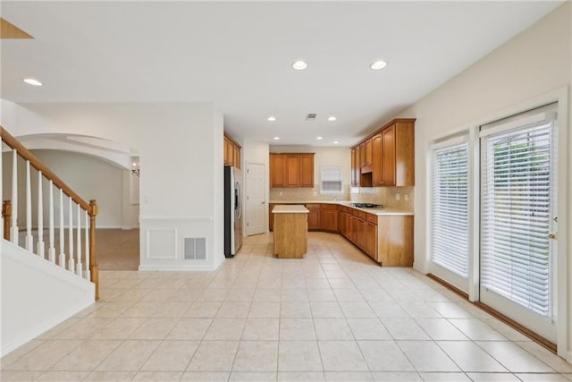 230 Collins View Ct, Lawrenceville, GA 30043 - kitchen with stainless steel appliances, plenty of natural light, light countertops, decorative backsplash, and recessed lighting