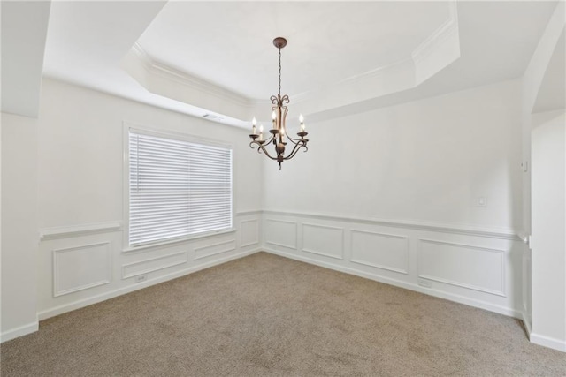 230 Collins View Ct, Lawrenceville, GA 30043 - empty room with ornamental molding, a chandelier, a raised ceiling, carpet floors, and a wainscoted wall