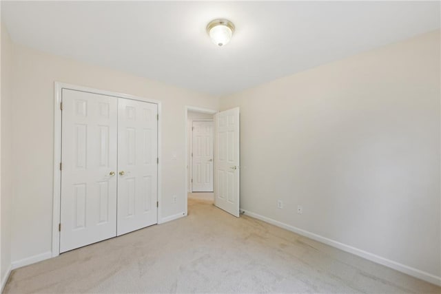 230 Collins View Ct, Lawrenceville, GA 30043 - unfurnished bedroom with carpet, baseboards, and a closet