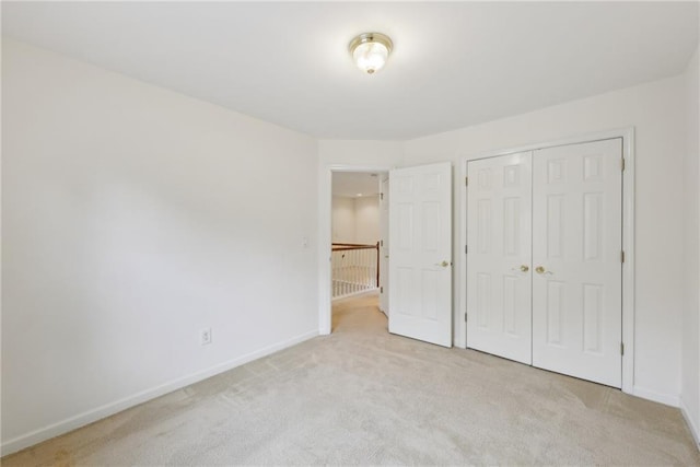 230 Collins View Ct, Lawrenceville, GA 30043 - unfurnished bedroom with carpet floors, baseboards, and a closet