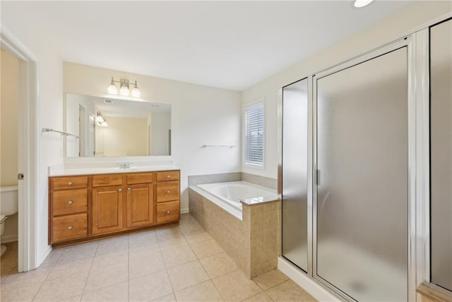 230 Collins View Ct, Lawrenceville, GA 30043 - bathroom with vanity, a bath, toilet, tile patterned floors, and a shower stall