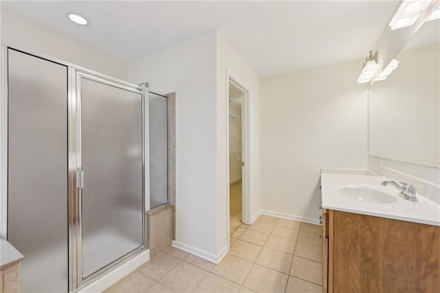 230 Collins View Ct, Lawrenceville, GA 30043 - full bath featuring vanity, a stall shower, tile patterned floors, a spacious closet, and baseboards