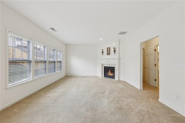 230 Collins View Ct, Lawrenceville, GA 30043 - unfurnished living room with light carpet, a fireplace with flush hearth, and baseboards