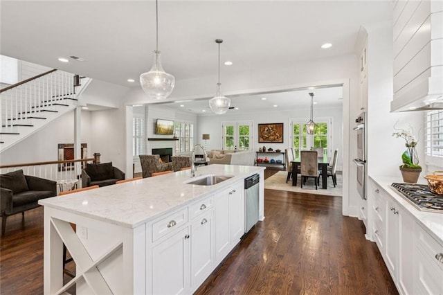 5971 Brundage Ln, Norcross, GA 30071 - kitchen featuring a sink, open floor plan, appliances with stainless steel finishes, premium range hood, and recessed lighting