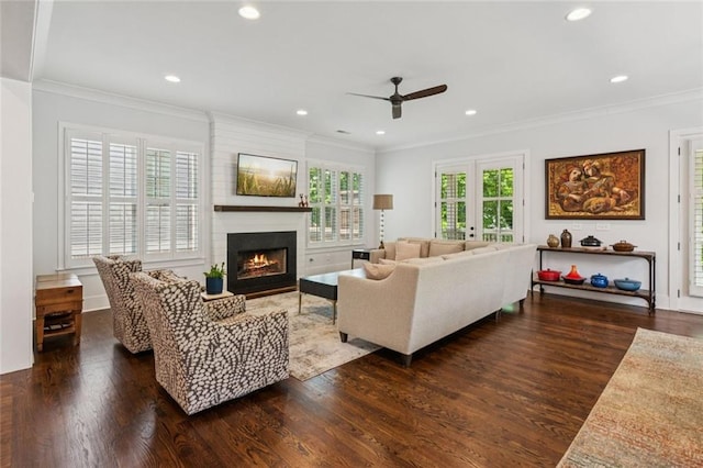 5971 Brundage Ln, Norcross, GA 30071 - living room with ceiling fan, wood finished floors, a large fireplace, ornamental molding, and recessed lighting