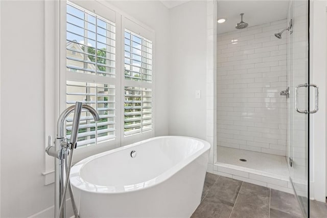 5971 Brundage Ln, Norcross, GA 30071 - full bath featuring a shower stall, a freestanding tub, tile patterned floors, and baseboards