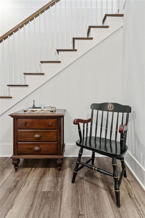 5971 Brundage Ln, Norcross, GA 30071 - sitting room with wood finished floors, stairway, and baseboards