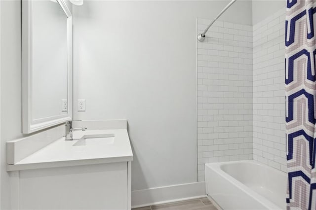 5971 Brundage Ln, Norcross, GA 30071 - bathroom with vanity, washtub / shower combination, and baseboards