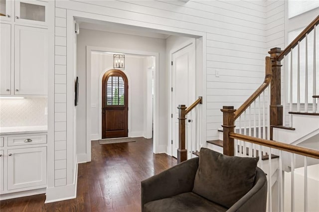 5971 Brundage Ln, Norcross, GA 30071 - entryway with stairway, dark wood-style flooring, baseboards, and wooden walls