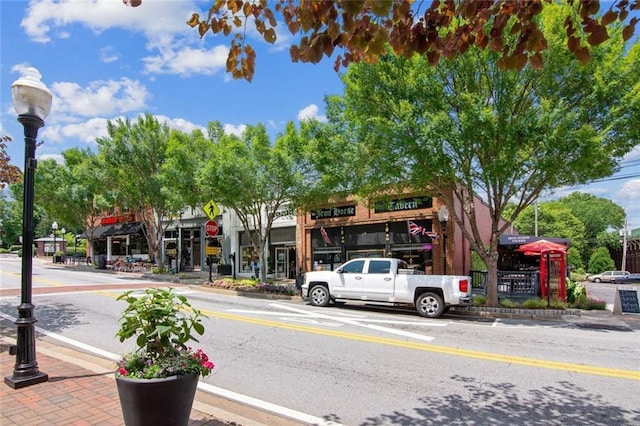 5971 Brundage Ln, Norcross, GA 30071 - view of asphalt street featuring street lighting, curbs, and sidewalks