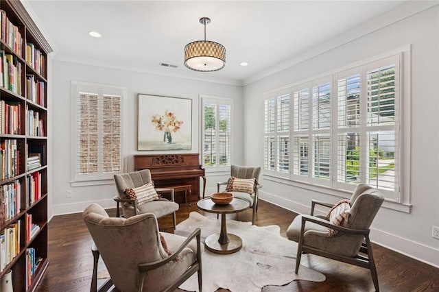 5971 Brundage Ln, Norcross, GA 30071 - living area with baseboards, ornamental molding, wood finished floors, wall of books, and recessed lighting