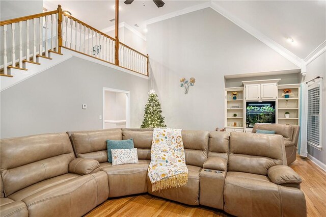 living room featuring ceiling fan, french doors, crown molding, and light hardwood / wood-style flooring