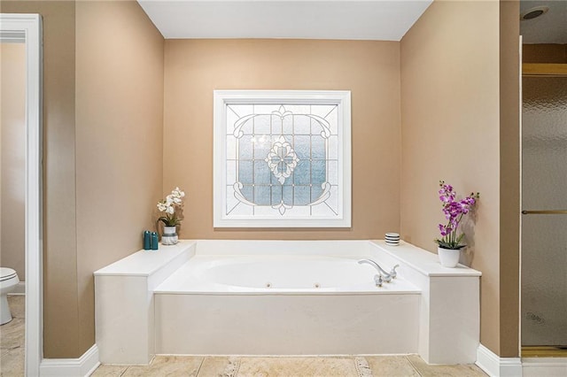 full bath with toilet, a shower stall, a whirlpool tub, and tile patterned flooring