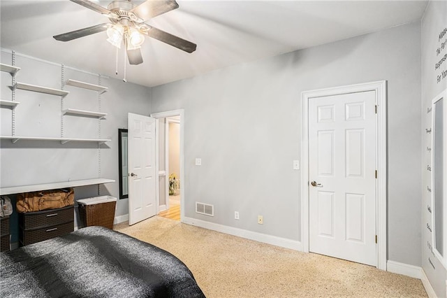 bedroom featuring a ceiling fan, baseboards, and visible vents