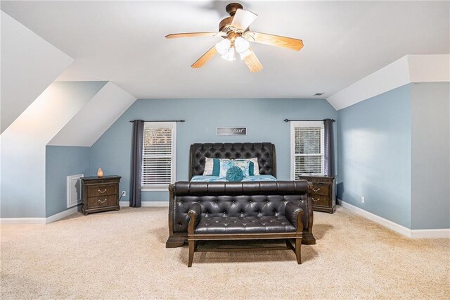 bedroom featuring ceiling fan, light colored carpet, and lofted ceiling