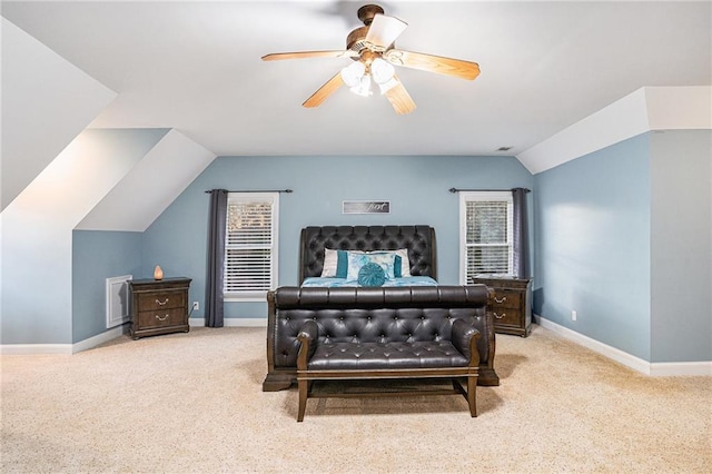 carpeted bedroom featuring lofted ceiling, a ceiling fan, and baseboards