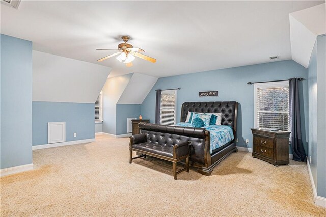 bedroom featuring ceiling fan, light colored carpet, and lofted ceiling