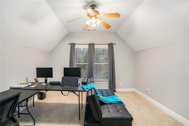 home office with visible vents, baseboards, ceiling fan, and vaulted ceiling