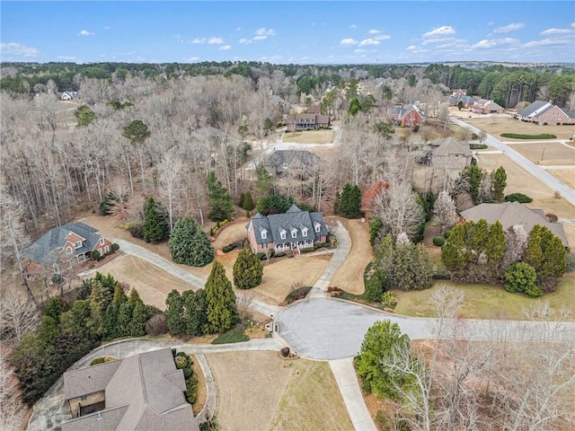 bird's eye view featuring a wooded view