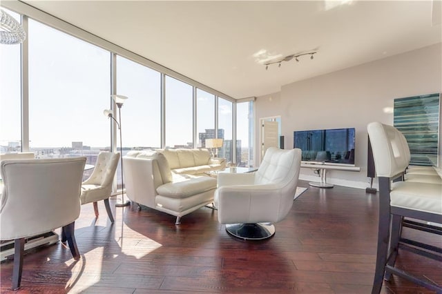 bedroom with floor to ceiling windows and access to outside