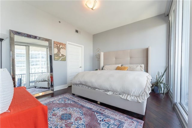 bedroom with access to outside, baseboards, visible vents, and wood finished floors