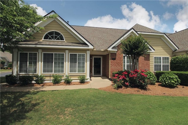 1105 Sweet Apple Cir, Alpharetta, GA 30004 - view of front of home featuring a front lawn, roof with shingles, and brick siding