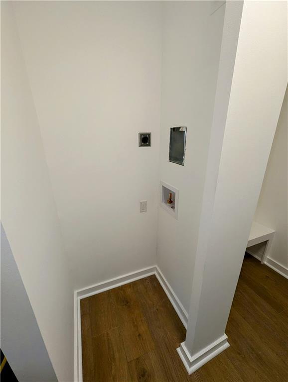 4430 Locksley Rd, Tucker, GA 30084 - laundry room with electric dryer hookup, washer hookup, dark wood-style floors, baseboards, and laundry area