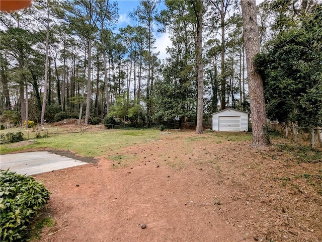 4430 Locksley Rd, Tucker, GA 30084 - view of yard featuring a garage, an outbuilding, and fence